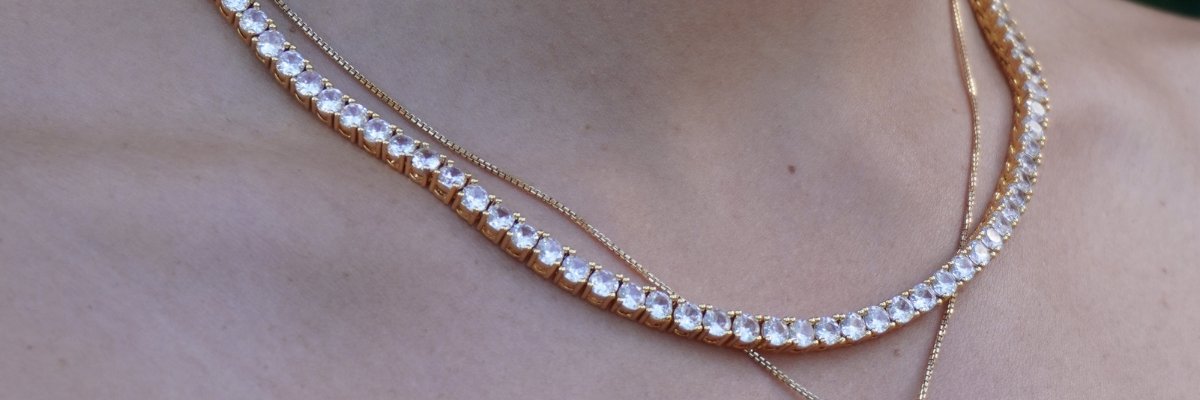 female wearing 4mm gold tennis chain on neck