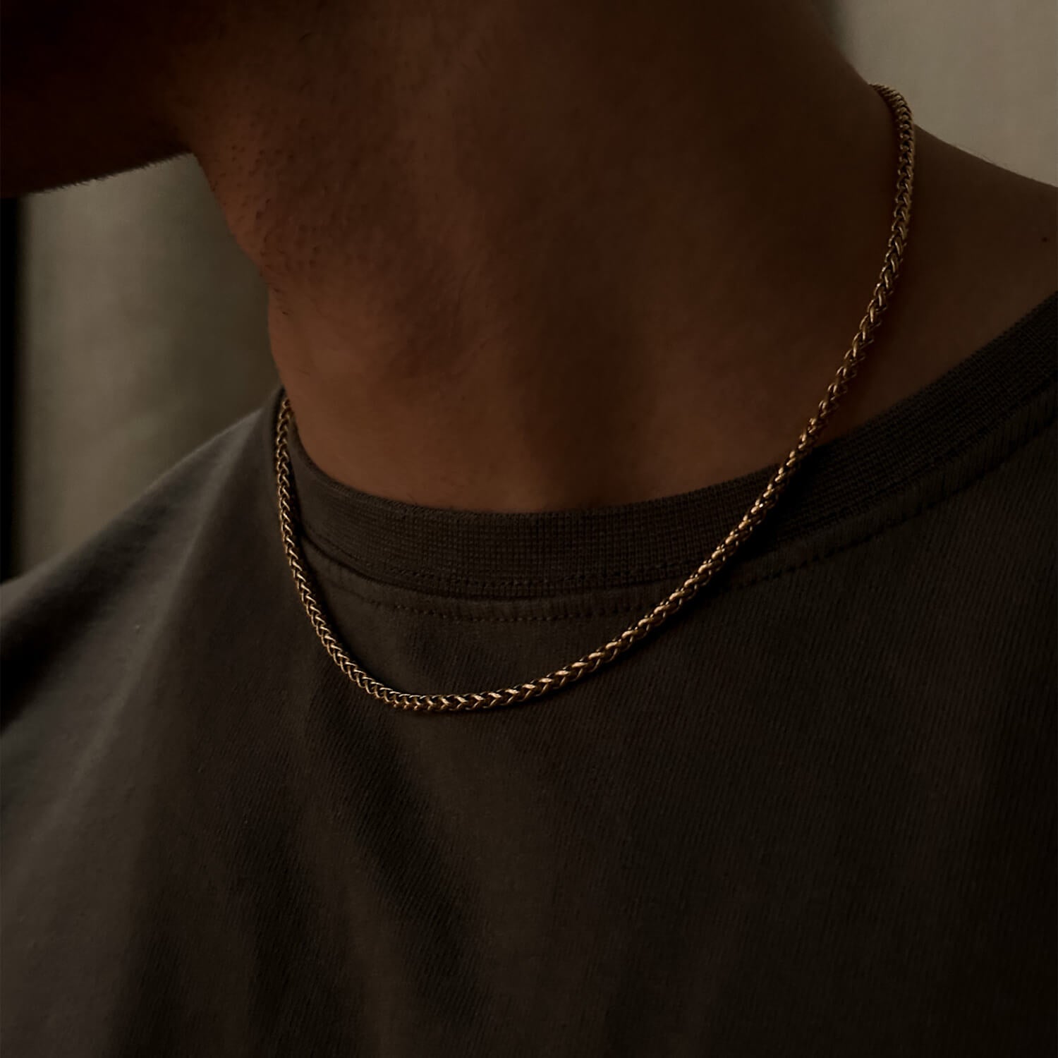 male wearing 3mm gold wheat chain on neck
