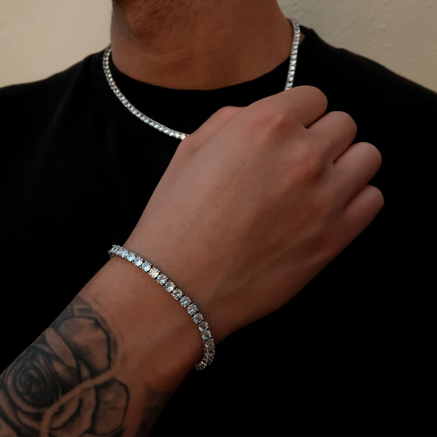 male wearing 4mm tennis bracelet and chain in silver