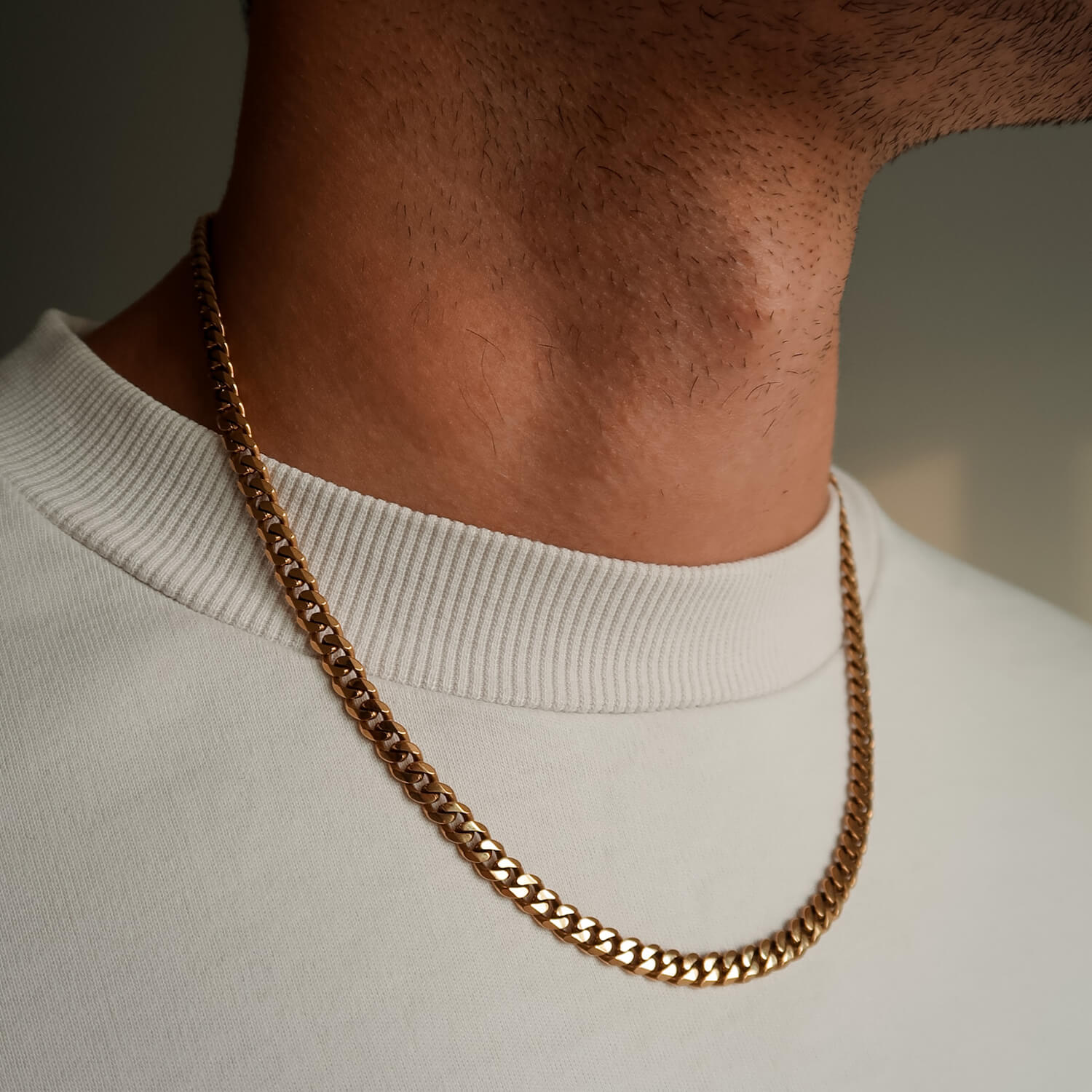 5mm gold cuban link chain on male neck