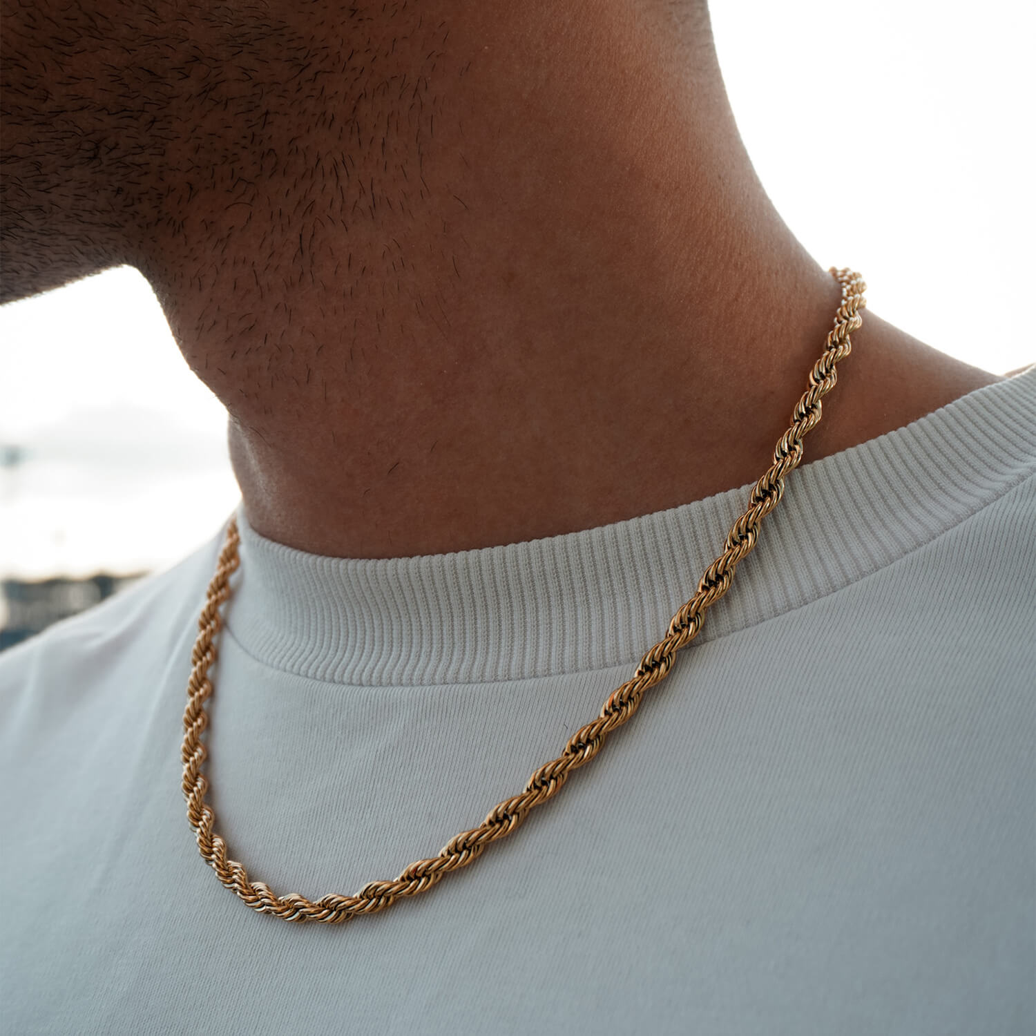 male wearing 5mm gold rope chain on neck