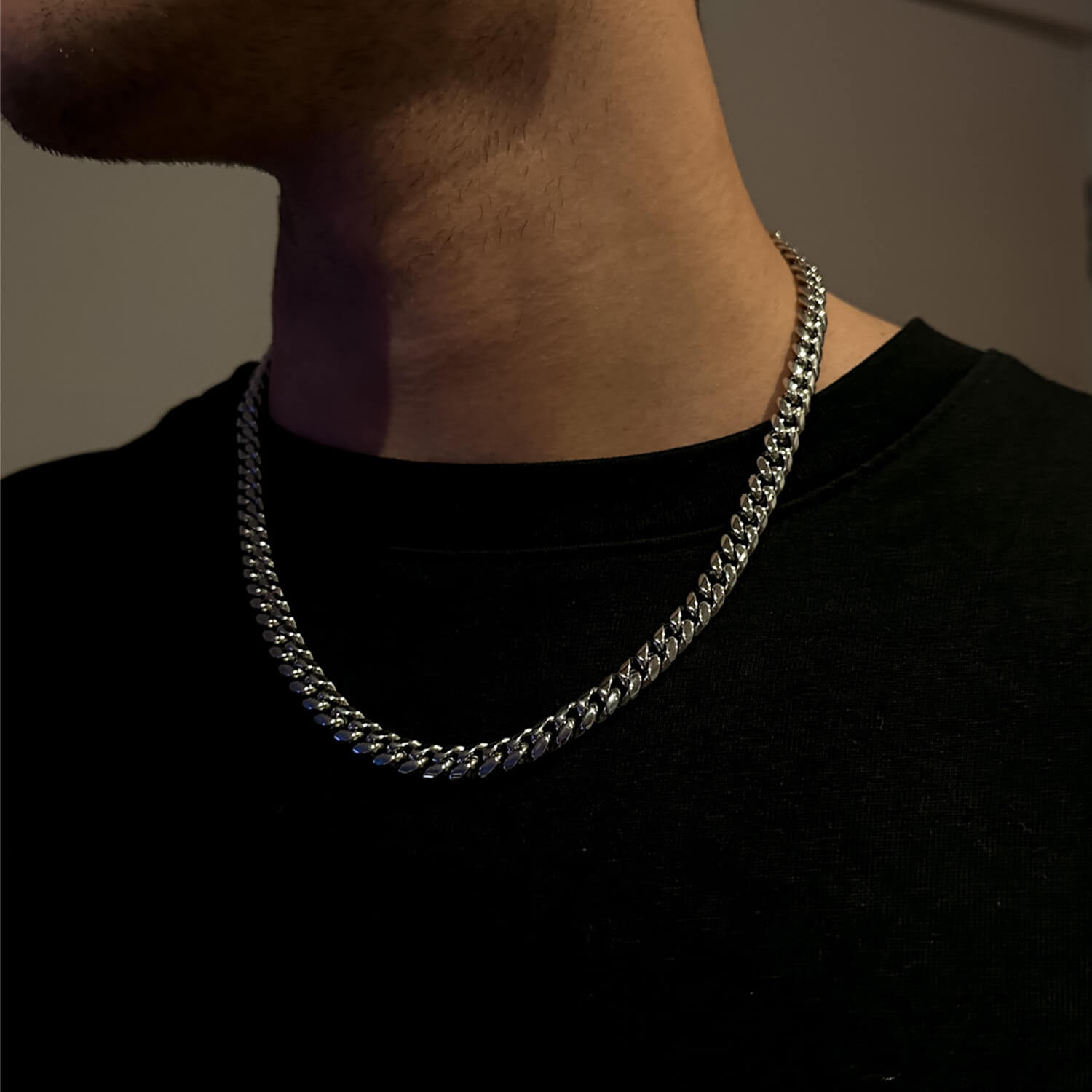 male wearing 8mm silver miami cuban link chain on neck