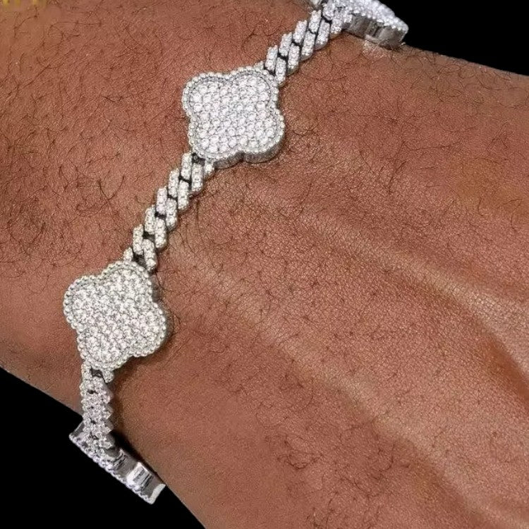 person wearing white gold cuban clover moissanite bracelet